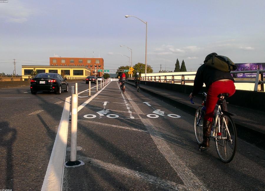 Cyclist travelling through a city route